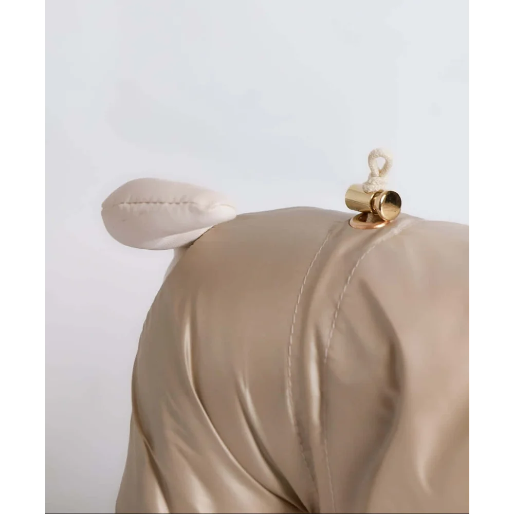 Beige satin-like fabric handbag with plush ear and gold-tone clasp complementing kombinezon dla psa with fur hood