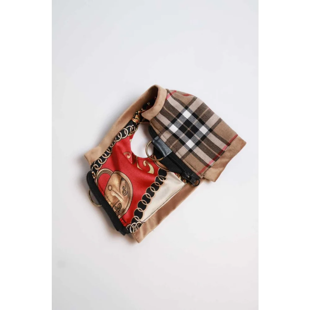 A stylish patchwork handbag with red silk gold chain panel black trim beige suede and burberry check fabric