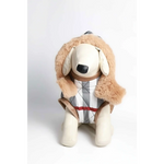 A beige plush dog wearing a tan faux fur hooded kurtka przeciwdeszczowa pikowana with a gray white and red checkered vest