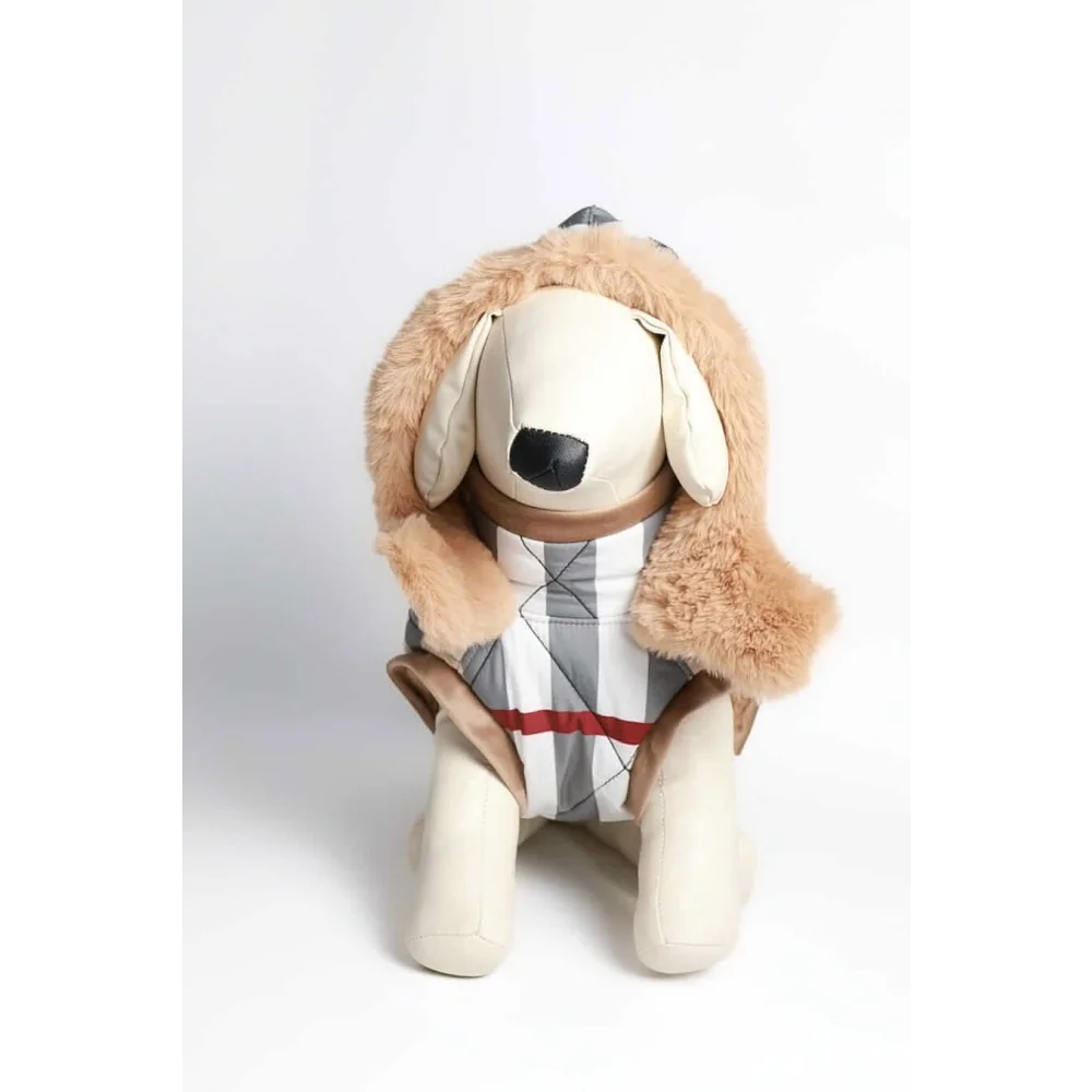 A beige plush dog wearing a tan faux fur hooded kurtka przeciwdeszczowa pikowana with a gray white and red checkered vest