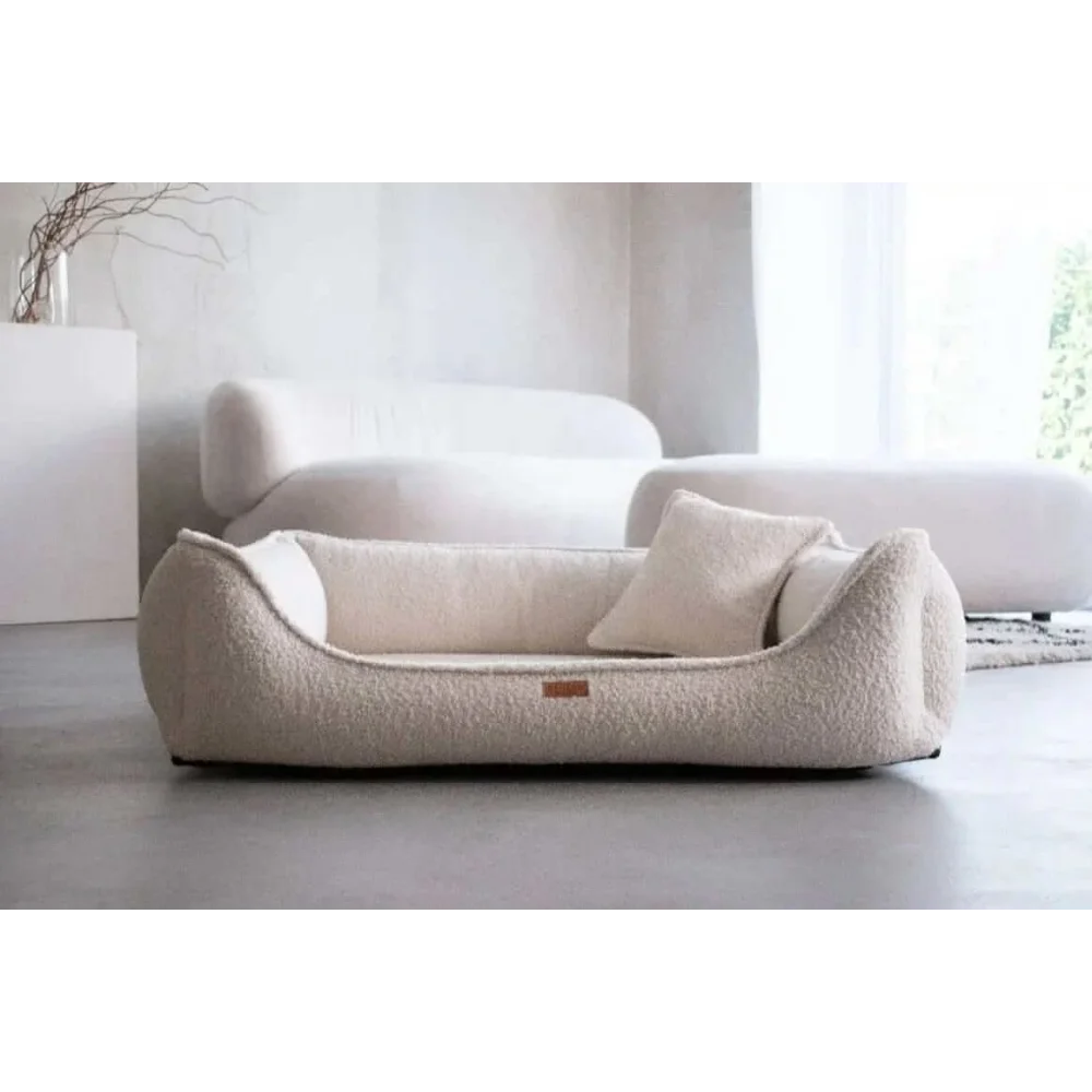 Cream-colored plush fleece dog bed with cushioned interior and pillow in legowisko belluno boucle beige style