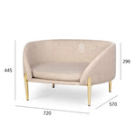 Beżowa aksamitna sofa dla zwierząt z nogami z metalu w złotym kolorze.