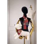 A rich burgundy silk riviera set scarf with gold and navy patterns featuring horses and chains for psa and humans