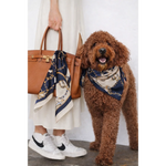 Brown leather handbag with gold hardware and navy blue silk riviera set scarf for psa featuring gold chain motifs