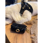 Black glossy dog waste bag holder with gold-tone metal clasp and key ring for premium szelki dla psa accessories