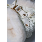 White quilted boot with fluffy faux fur lining and gold tone hardware featuring okucia pokryte 24k zlotem