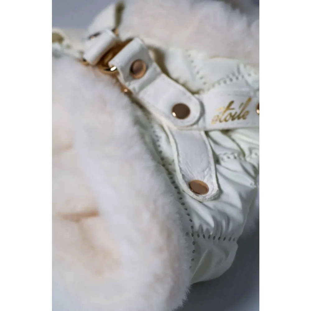 White quilted boot with fluffy faux fur lining and gold tone hardware featuring okucia pokryte 24k zlotem