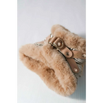 Beige faux fur-lined winter boot with tan leather straps and metallic buckles designed for obwód szyi dla psa use